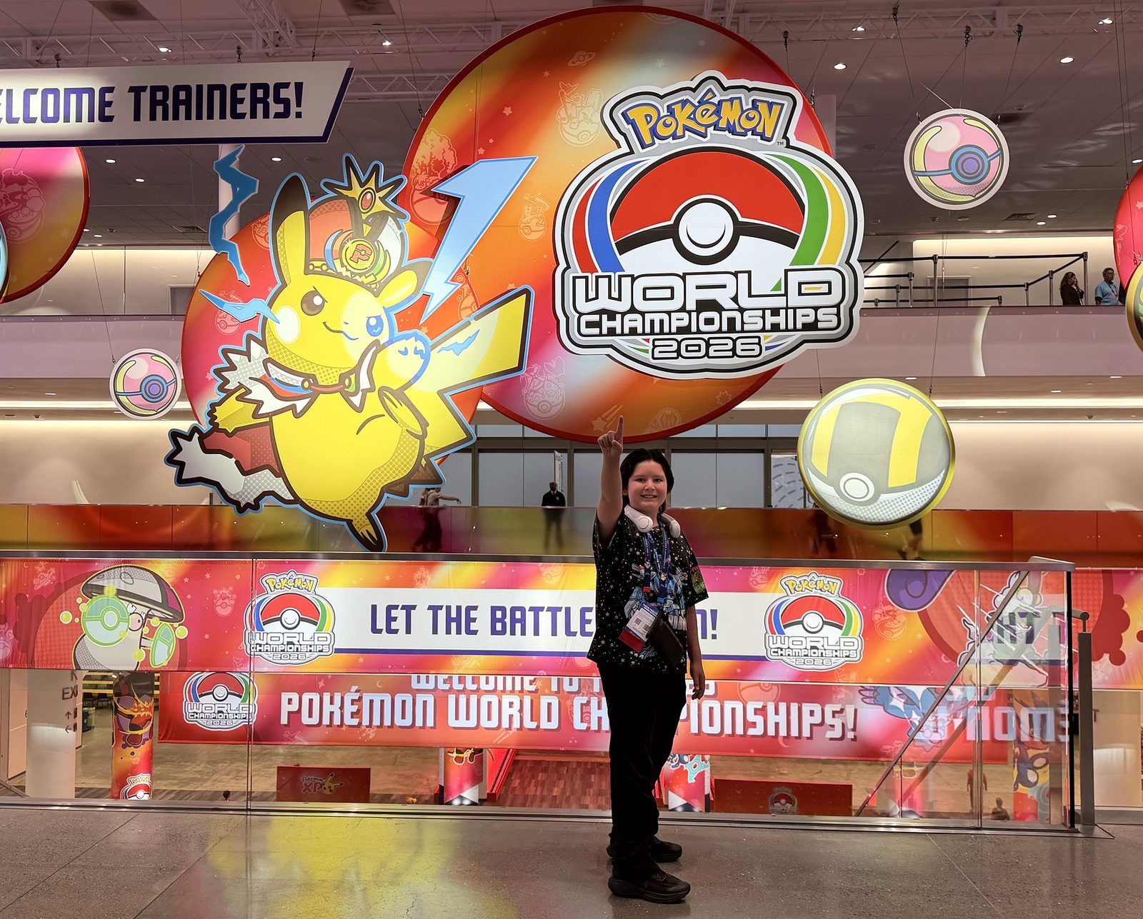 Dragoneye Duke pointing up beneath the Pokémon World Championships 2026 sign in San Francisco